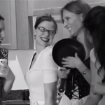 A group of women laughing in a Kitchen