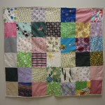 Various patches of fabric quilted together